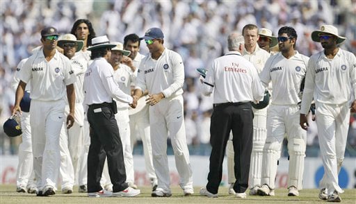 Indian players are congratulated by the umpires after defeating Australia on the final day of the second Test between India and Australia in Mohali. India vs Australia: 2nd Test, Day 5