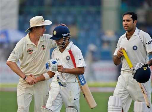 Gautam Gambhir is congratulated by Brett Lee as Indian VVS Laxman, right, looks on as they return after end of play on the first day of their third cricket Test match in New Delhi on Wednesday, October 29, 2008. Gambhir scored his second hundred in consecutive matches with an unbeaten 149. India vs Australia: 3rd Test, Day 1