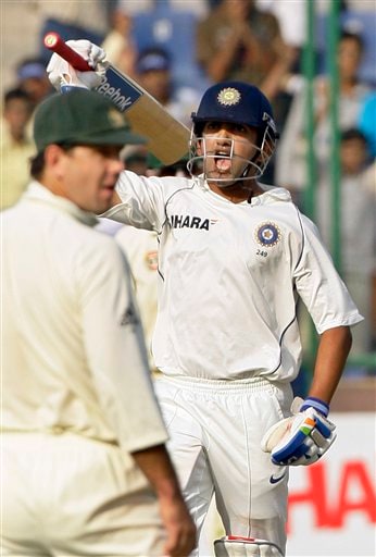 Gautam Gambhir celebrates his century as Australian captain Ricky Ponting, foreground left, looks on, during the first day of the third cricket Test match between India and Australia in New Delhi on Wednesday, October, 2008. India vs Australia: 3rd Test, Day 1