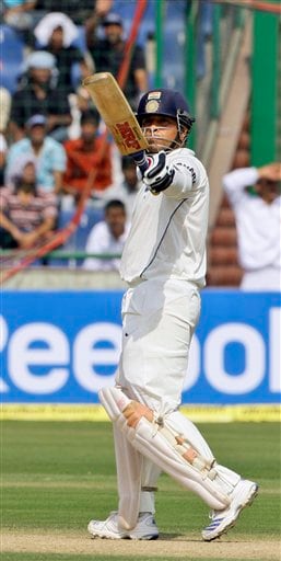 Sachin Tendulkar acknowledges the crowd after scoring half a century against Australia during the first day of their third cricket Test match in New Delhi on Wednesday, October, 2008. India vs Australia: 3rd Test, Day 1
