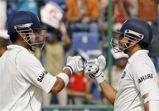 Gautam Gambhir congratulates teammate Sachin Tendulkar for scoring half a century during the first day of their third cricket Test match against Australia in New Delhi on Wednesday, October, 2008. India vs Australia: 3rd Test, Day 1