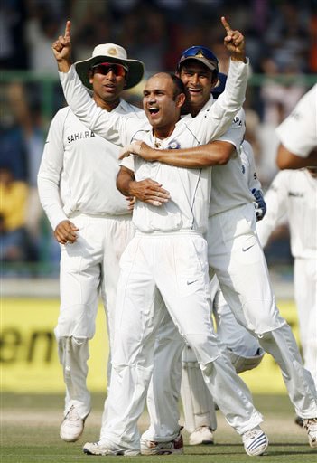 Anil Kumble celebrates with teammates Virender Sehwag and VVS Laxman after Sehwag took the wicket of Cameron White for a five-wicket haul on the fourth day of the third Test match between India and Australia in New Delhi. India vs Australia: 3rd Test, Day 4
