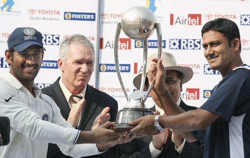 Former Australian captain Alan Borderand former Indian captain Sunil Gavaskar present the Border-Gavaskar trophy for winning the Test series to Indian captain Mahendra Singh Dhoni and former Indian captain Anil Kumble after India beat Australia in the final Test in Nagpur. India vs Australia: 4th Test, Day 5