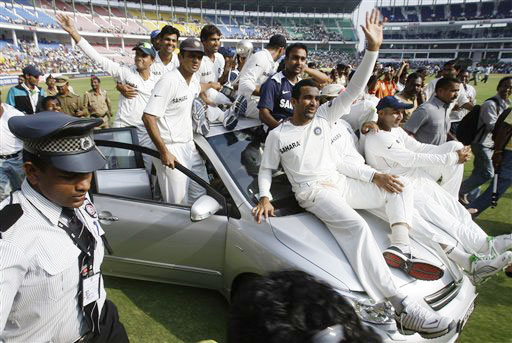 Indian team ride around the stadium on a car presented to Ishant Sharma as an award for Man of the Series after India beat Australia in the final Test in Nagpur. India vs Australia: 4th Test, Day 5