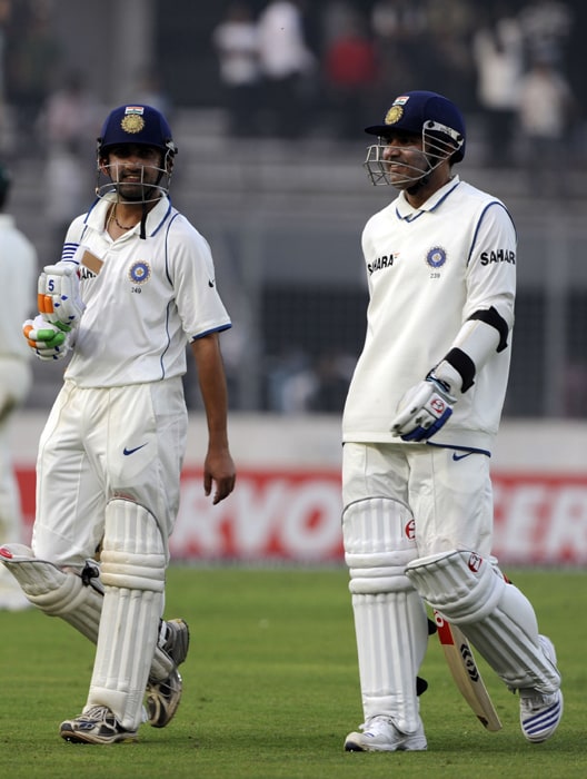 Gautam Gambhir and his teammate Virender Sehwag leave the ground after the first day of the second Test at The Sher-e Bangla National Stadium in Dhaka. India were 69 for no loss in their first innings at stumps in reply to Bangladesh's 233. (AFP Photo) Ind vs B'desh: 2nd Test, Day 1