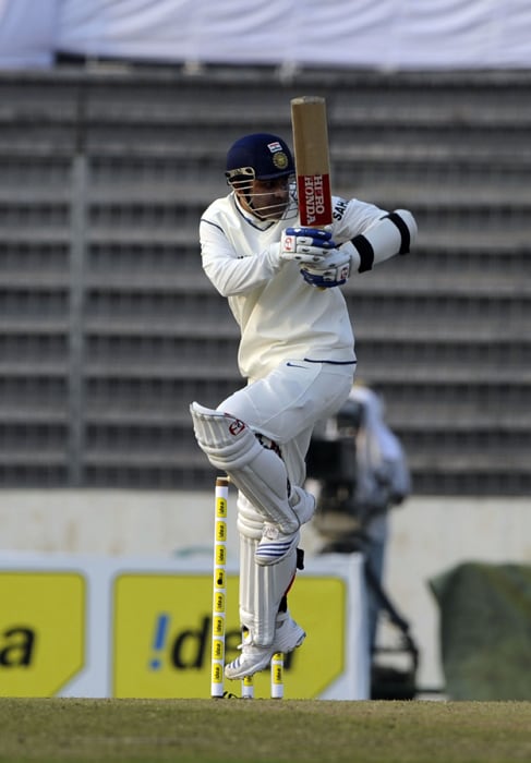 Virender Sehwag in action during the first day of the second Test at the Sher-e Bangla National Stadium in Dhaka. (AFP Photo) Ind vs B'desh: 2nd Test, Day 1
