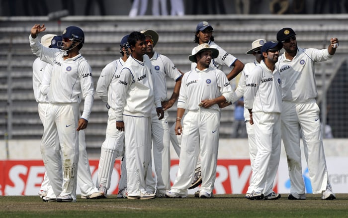 Indian cricketers wait for the third umpire's decision as they appeal for a run out during the first day of the second Test. Bangladesh captain Shakib Al Hasan won the toss and elected to bat in the second and final cricket Test against India who won the first Test in Chittagong by 113 runs. (AFP Photo) Ind vs B'desh: 2nd Test, Day 1