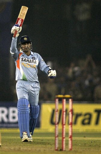 Virender Sehwag acknowledges the crowd after scoring fifty runs during the fifth One-Day International match between India and England in Cuttack. (AP Photo) India vs England: 5th ODI