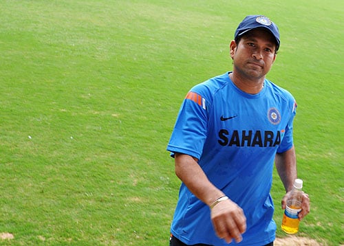 Sachin Tendulkar gestures as he walks from the National Cricket Academy (NCA) The M. Chinnaswamy Stadium in Bangalore. (AFP Photo) Team India fitness camp