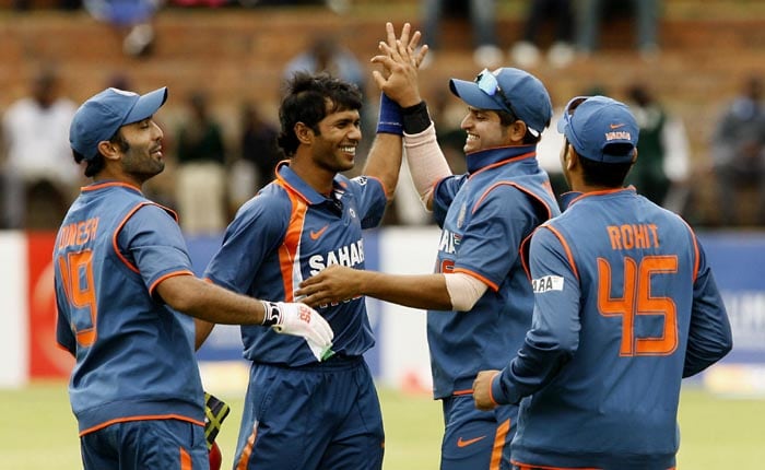 Indian players celebrating after Sri Lankan batsman Nuwan Kulasekara was bowled out by Indian bowler Ashok Dinda in the second match of the Micromax Cup Triangular One-Day International at Queens Sports club in Bulawayo . (AFP Photo) 2nd ODI: Ind vs Zim