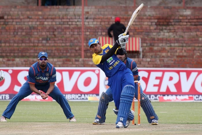 Sri lankan captain Tillekeratne Dilshan hits a six during a match against India at Queens Sports Club in Bulawayo, Zimbabwe.(AP Photo) 2nd ODI: Ind vs Zim