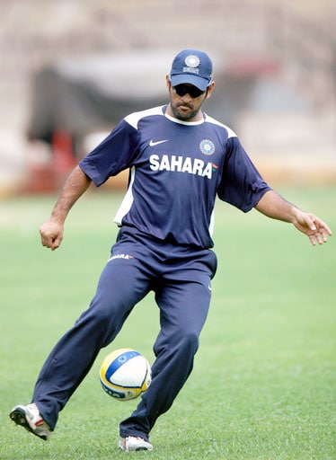 MS Dhoni plays football during the 6-day training session ahead of the Australian series at Chinnaswamy Stadium in Bangalore. (PTI Photo) Indian players at conditioning camp