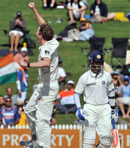 Iain O'Brien, left, celebrates the wicket of Rahul Dravid for 66 on the second day of the first Test in Hamilton, New Zealand. (AP Photo) India vs NZ: 1st Test, Day 2