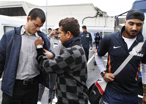 Sachin Tendulkar, centre, signs his autograph on his arrival at Christchurch airport on Friday, February 20, 2009. India will play three Test matches, five one-day internationals and two twenty20 matches during the cricket tour of New Zealand. (AP Photo) India arrive in New Zealand