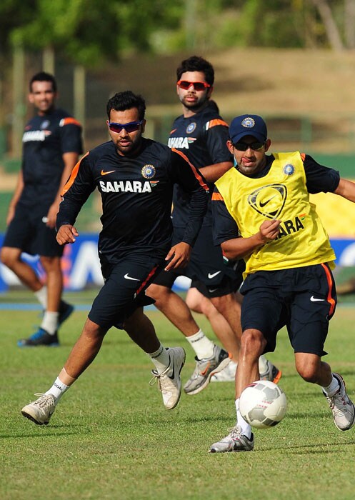 Indian cricketers Gautam Gambhir,Rohit Sharma and Virat Kohli play football during a training session. (AFP PHOTO) India, Pakistan gear up for big clash