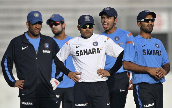 S Sreesanth puts out his tongue as his teammates and captain Mahendra Singh Dhoni look on during a practice session in Dhaka. (AP Photo) India sweat on Bangla soil