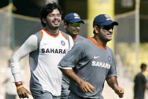 Shantakumaran Sreesanth, left, Piyush Chawla, center, and Mahendra Singh Dhoni run during a practice session in Chennai on Tuesday, March 25, 2008. The first Test of Future Cup cricket series between India and South Africa is scheduled to start on March 26. India's practice session