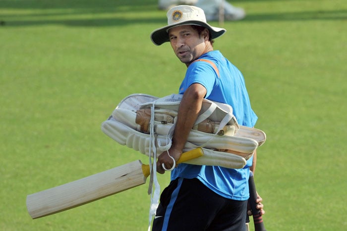 Sachin Tendulkar walks to bat during a training session ahead of the final Test against Sri Lanka in Mumbai. (AFP Photo) India warm up for 3rd Test