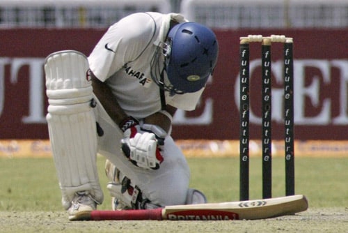 Rahul Dravid grimaces in pain as a ball hits his hand during the second day of the third Test match of the Future Cup series against South Africa, in Kanpur on Saturday, April 12, 2008. Kanpur Test, Day 2