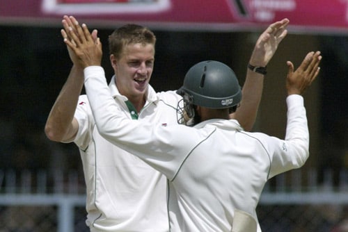 Morne Morkel, left, and Hashim Amla celebrate the dismissal of Wasim Jaffer, unseen, during the second day of the third Test cricket match of the Future Cup series in Kanpur on Saturday, April 12, 2008. Kanpur Test, Day 2
