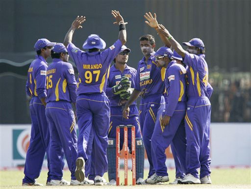 Sri Lankan team congratulate their bowler Farveez Maharoof for taking the wicket of Gautam Gambhir during the second One-Day International between India and Sri Lanka in Colombo. 2nd ODI: India vs Sri Lanka