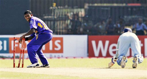 Thilina Thushara breaks the wicket to dismiss Virender Sehwag during the second One-Day International between India and Sri Lanka in Colombo. 2nd ODI: India vs Sri Lanka