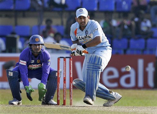 Mahendra Singh Dhoni plays a shot as wicket-keeper Kumar Sangakkara looks on during the final ODI match between India and Sri Lanka in Colombo on Sunday. (AP Photo) 5th ODI: India vs Sri Lanka