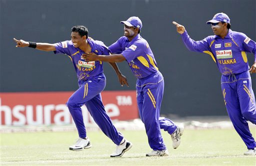 Thilan Thushara, Chamara Kapugedara and Mahela Jayawardene celebrate the dismissal of Virender Sehwag during the final ODI match between India and Sri Lanka in Colombo on Sunday. (AP Photo) 5th ODI: India vs Sri Lanka