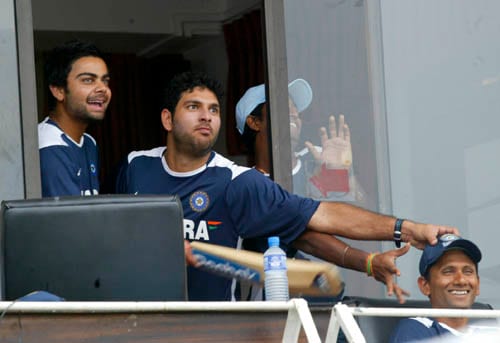 India's Virat Kohli, left and Yuvraj Singh, second left, share a light moment with bowling coach Venkatesh Prasad in Colombo. India vs Sri Lanka - 4th ODI