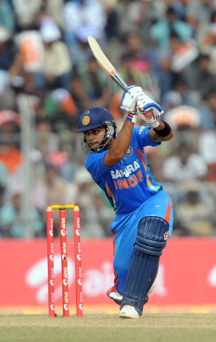 Indian cricketer Virat Kohli plays a shot during the first one-day International cricket match against New Zealand at Nehru Stadium in Guwahati. (AFP Photo) 1st ODI: Ind v NZ