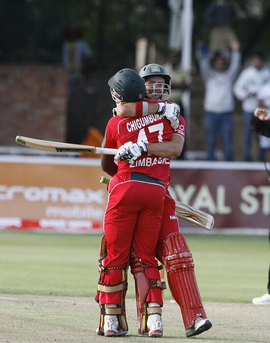 Chigumbura and Ervine celebrate after winning the match against India by six wickets in the first match of the Micromax Cup Triangular One-day International series. (AFP Photo) 1st ODI: Ind vs Zim