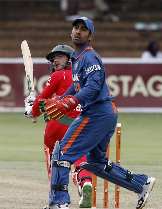 Zimbabwean Batsman Greg Lamb goes for a sweep shot which went past Indian wicket keeper Dinesh Karthik. (AFP Photo) 1st ODI: Ind vs Zim