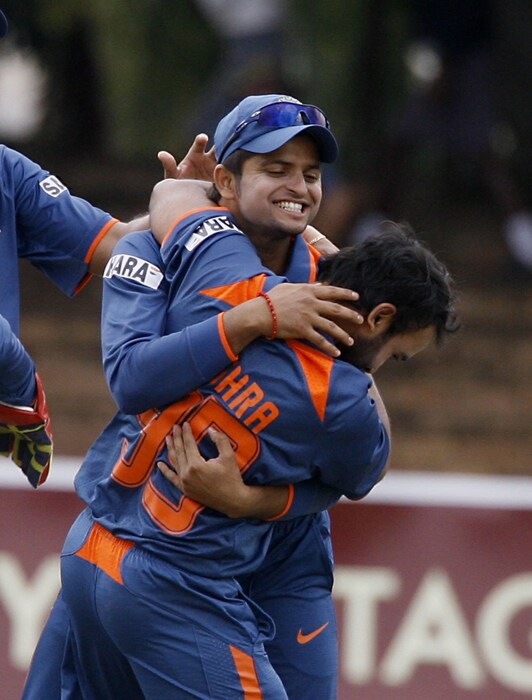 Suresh Raina and Amit Mishra celebrate the wicket of Zimbabwean batsman Hamilton Masakadza. (AFP Photo) 1st ODI: Ind vs Zim