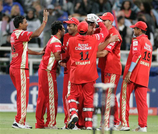 Bangalore Royal Challengers team members reacts after taking the wicket of Munaf Patel during the Indian Premier League Twenty20 match in Cape Town(AP Photo) Match 2: JAI vs BLR