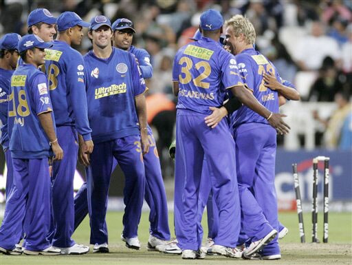 Shane Warne reacts with fellow team members after taking the wicket of Balachandra Akhil during the Indian Premier League Twenty20 match in Cape Town. (AP Photo) Match 2: JAI vs BLR