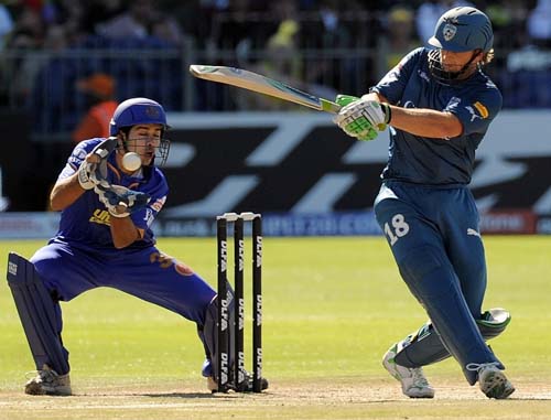 Deccan Chargers' Adam Gilchrist is watched by Rajasthan Royals wicketkeeper Naman Ojha as he plays a shot during their IPL match at The St.Georges Park in Port Elizabeth on Saturday. (AFP Photo) Match 25: JAI vs HYD