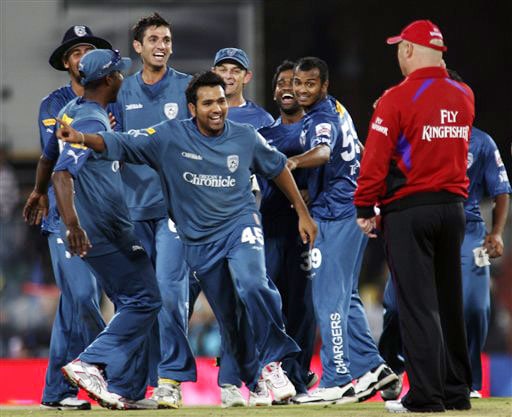 Deccan Chargers Rohit Sharma along with his teammates celebrates his hat-trick against Mumbai Indians during their IPL match in Pretoria. (AP Photo) Match 32: MUM vs HYD