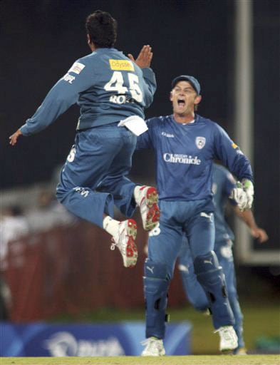 Rohit Sharma and Adam Gilchrist, celebrate the dismissal of Harbhajan Singh during their IPL match in Pretoria. (AP Photo) Match 32: MUM vs HYD