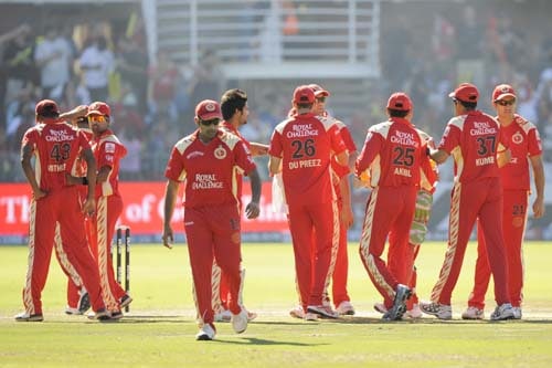 Royal Challengers Bangalore cricketers celebrate the dismissal of Mumbai Indians' Sanath Jayasuryia during their IPL match in Port Elizabeth on Sunday. (AFP Photo) Match 38: MUM vs RCB