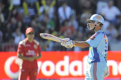 Mumbai Indians' JP Duminy raises his bat as he celebrates completing a half-century during the IPL match against Royal Challengers Bangalore in Port Elizabeth on Sunday. (AFP Photo) Match 38: MUM vs RCB