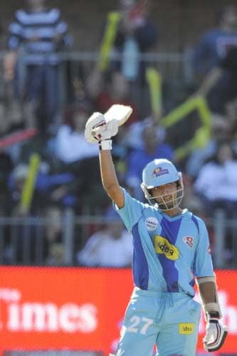 Mumbai Indians' Ajinkya Rahane raises his bat as he celebrates scoring a half-century during the IPL match against Royal Challengers Bangalore in Port Elizabeth on Sunday. (AFP Photo) Match 38: MUM vs RCB