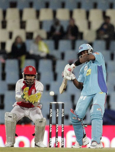 Dwayne Bravo plays a shot as Punjab wicketkeeper Kumar Sangakkara looks on during the IPL match at the Super Sport Park in Pretoria. (AP Photo) Match 42: MUM vs MOH