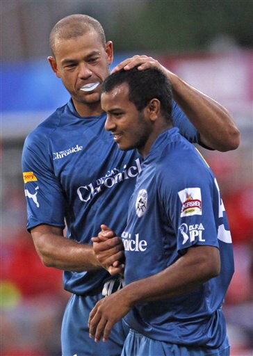 Andrew Symonds congratulates his teammate Dwaraka Ravi Teja after he took a successful catch for the dismissal of Tillakaratne Dilshan during their IPL match in Durban. (AP Photo) Match 43: DEL vs HYD