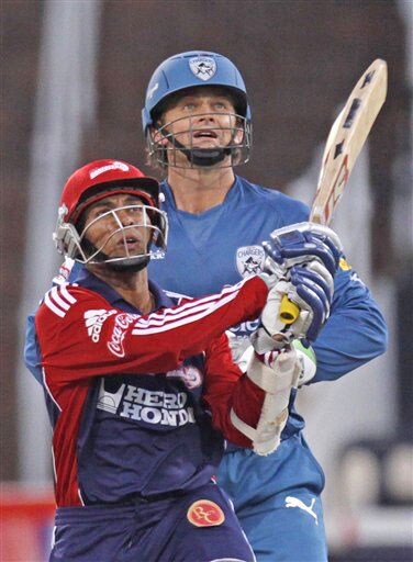 Tillakaratne Dilshan plays a shot as Adam Gilchrist looks on during their IPL match in Durban. (AP Photo) Match 43: DEL vs HYD