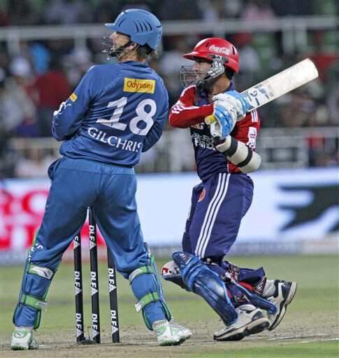 Dinesh Karthik plays a shot as Adam Gilchrist looks on during their IPL match in Durban. (AP Photo) Match 43: DEL vs HYD