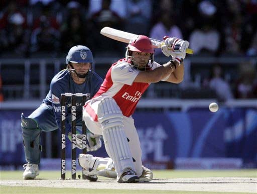 Kings XI Punjab captain Yuvraj Singh plays a shot as Deccan Chargers captain Adam Gilchrist looks on during the IPL match at the Wanderers stadium in Johannesburg on Sunday. (AP Photo) Match 49: HYD vs MOH