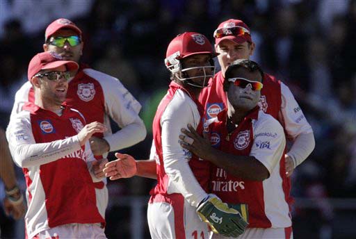 Kings XI Punjab's Ramesh Powar celebrates with teammates Kumar Sangakkara and Luke Pomersbach on the dismissal of Deccan Chargers captain Adam Gilchrist for 23 runs during the IPL match at the Wanderers stadium in Johannesburg on Sunday. (AP Photo) Match 49: HYD vs MOH