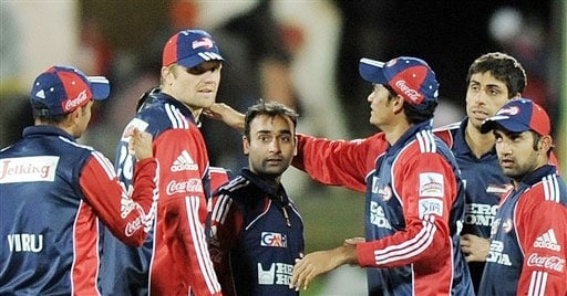 Amit Mishra of celebrates with teammates after taking the wicket of Shane Warne during their IPL match. (AFP Photo) Match 50: DEL vs JAI