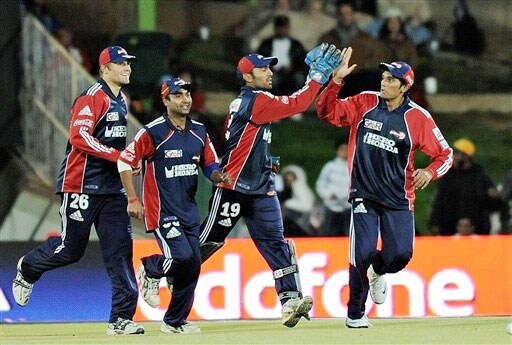 Dinesh Karthik celebrates with teammates after taking a catch to dismiss Yusuf Pathan during their IPL match in Bloemfontein. (AFP Photo) Match 50: DEL vs JAI