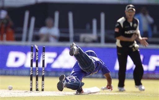 Bails fly for the dismissal of Rajasthan Royals' Swapnil Asnodkar, diving unsuccessfully while batting against Kolkata Knight Riders during their IPL match in Durban on Wednesday. (AP Photo) Match 53: JAI vs KKR